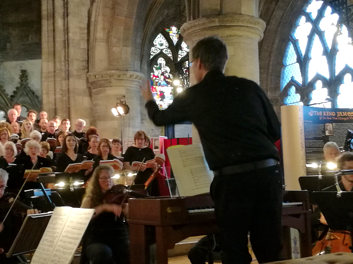 Alistair Warwick conducting Stirling University Choir with professional orchestra in Messiah
