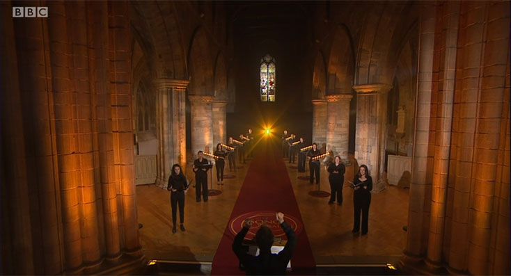 Alistair Warwick conducting members of Stirling University Choir in BBC Sunday Morning Worship